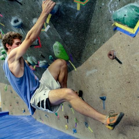 student on climbing wall